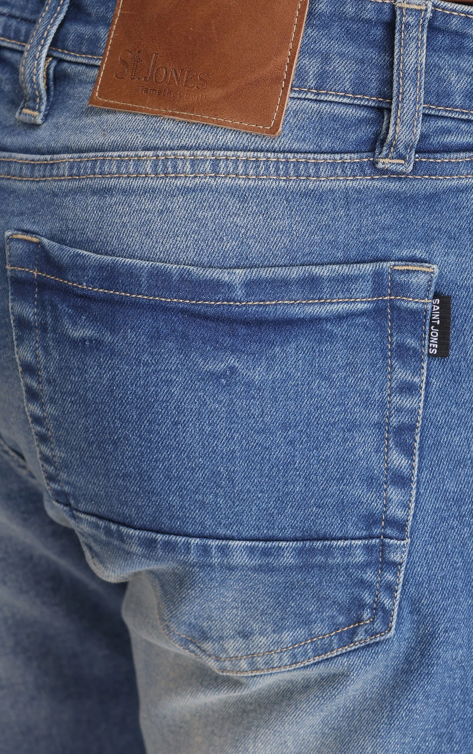 BLUE MID RISE RIPPED SLIM FIT JEANS