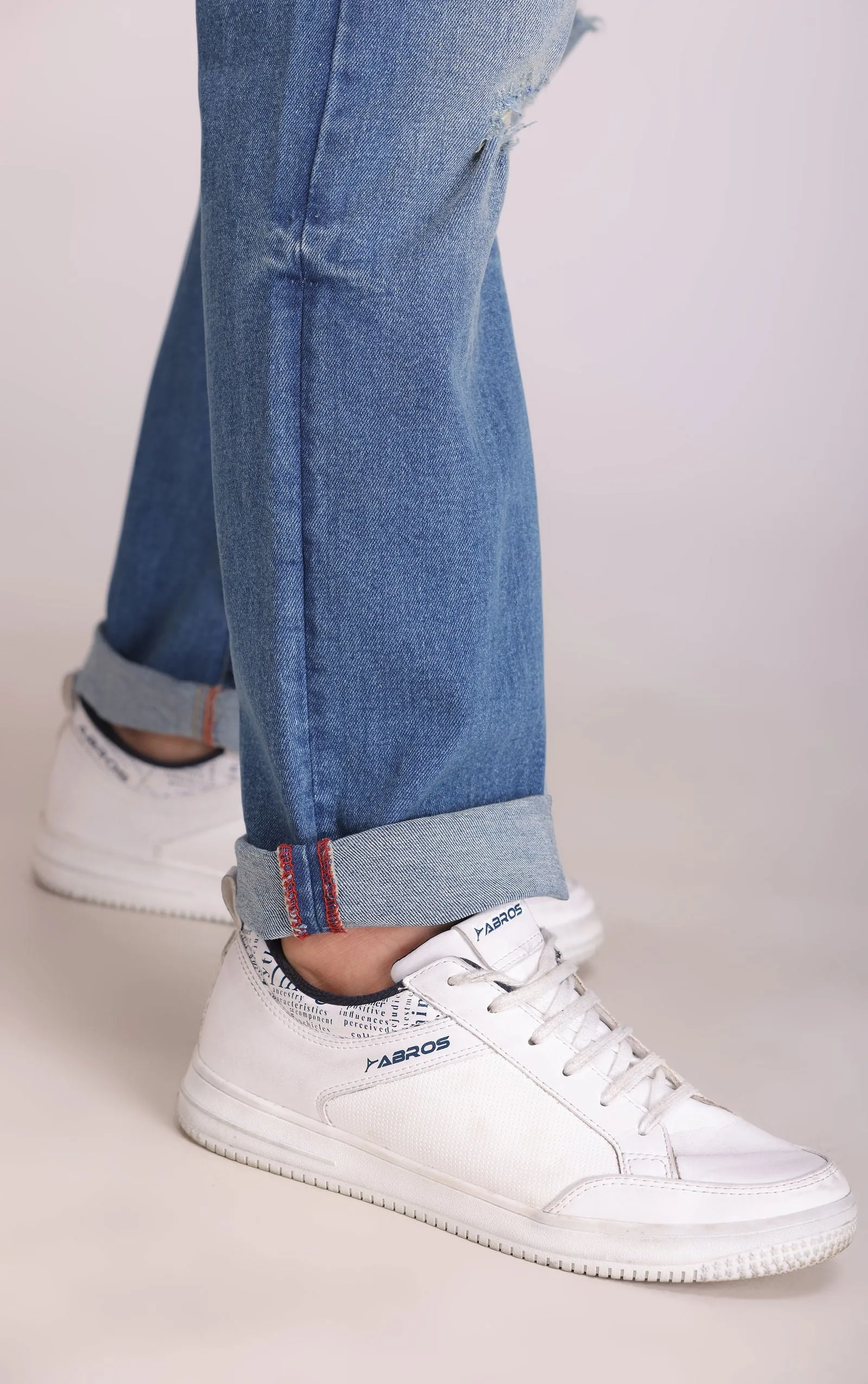 BLUE MID RISE RIPPED SLIM FIT JEANS